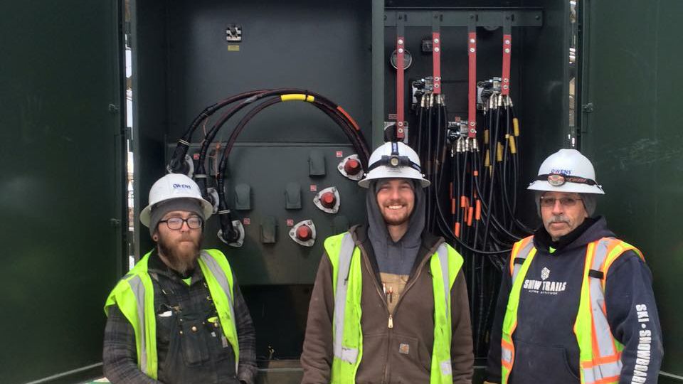 Owens Electric Co. workers proudly finish another industrial panel